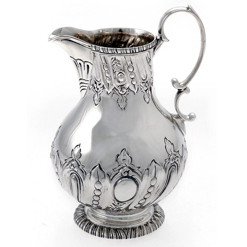 A curved oblong solid silver spirit flask with detachable gilt cup. Circa 1932